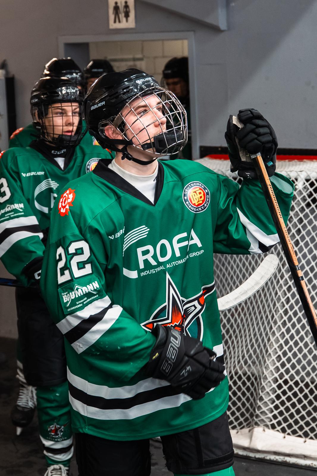 Nik preparing to enter the ice with his teammates